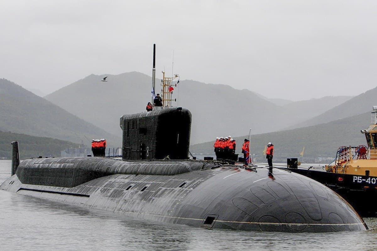 Clear photograph of the surfaced Borei-class submarine K-550 Alexander Nevsky, showing its bow, hull and sail.